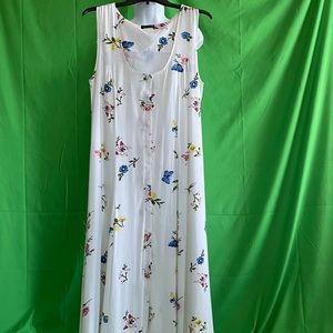 Beautiful light and airy sundress, buttons down the front, built in slip